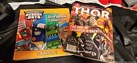 Front covers of both items: Rescue Bots book and Thor guide