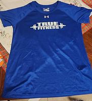 Front view of blue Under Armour True Fitness T-shirt showing graphic