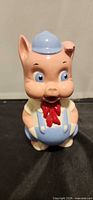 Front view of entire Porky Pig ceramic bank showing colors and form