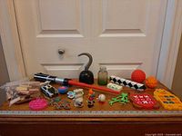 Full group view of all toys and fidget items laid out on surface