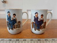 Front view of both mugs showing Norman Rockwell illustration