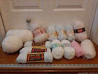 Full view of twelve skeins arranged in two rows, ruler for scale