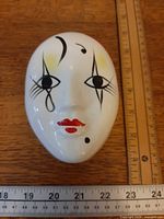 Top view of Pierrot face lid showing handpainted details