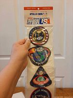 Header card showing NASA Kennedy Space Center Spaceport USA and first three patches