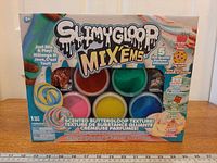 Front view of sealed SLIMYGLOOP Mix’ems slime kit box