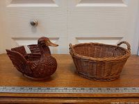 Duck basket and round basket side by side with ruler for scale