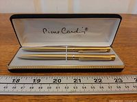 Set in open box showing both instruments