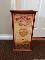 Front view showing full umbrella stand and printed panel