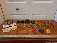 All 20 accessories arranged on table with ruler for scale
