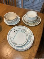 Group of all plates and bowls stacked on table