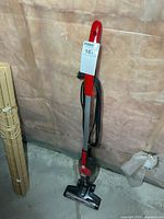 Full view of Dirt Devil Power Stick vacuum standing upright