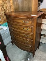 Front view of five-drawer highboy dresser