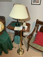 Full view of brass-tone floor lamp with shade