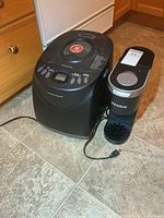 Front view of Hamilton Beach bread maker and Keurig coffee maker with cords