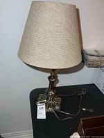 Full view of lamp with shade and cord visible