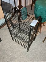 Front view of black 3-tier metal wire stand