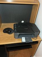 Canon Pixma printer and wireless mouse on desk