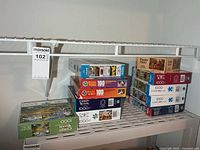 Shelf view of stacked puzzle boxes