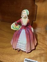 Front view of Royal Doulton Janet HN 1537 figurine on shelf