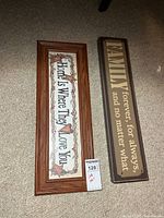 Both wooden signs side by side