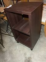 Three-quarter view of stand showing open front and side