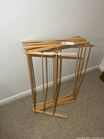 Rack folded flat against wall showing overall structure