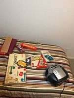 Overall view of games and radio on bed