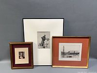 Three framed etchings together showing relative sizes and framing