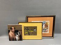 Three paintings grouped together