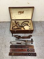 Full lot: chest, tongs, clamp, levels