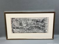 Full view of framed ink rubbing with mat and frame