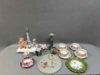 Full lot overview showing lamp and porcelain pieces