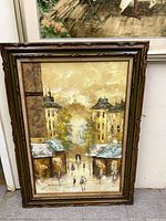 Full view of framed cityscape painting