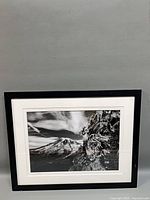 Front view of framed mountain photograph