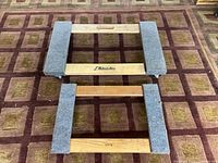 Top view of both hardwood dollies showing carpeted ends and size comparison