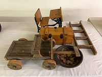 Group shot of wagon, chest, desk, ladder, bowl
