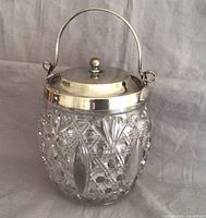 Full view of biscuit barrel with lid and handle upright