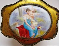Top view showing porcelain plaque of woman and cherub signed Ribot