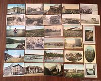 Overall grid of approximately 29 postcards showing fronts