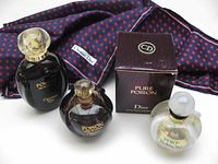 Group shot of scarf, three bottles and Pure Poison box