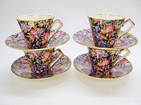 Eight-piece set of four cups stacked on four saucers