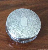 Sterling silver lid with scroll engraving and blank cartouche