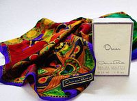 Silk scarf displayed with boxed eau de toilette