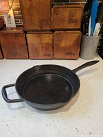 Angled view of skillet showing handles and spouts