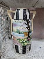 Full view of vase showing handles, painted scene and decorative panels