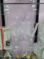 Three lead crystal wine glasses, boxed pitcher, partial view of inkwell