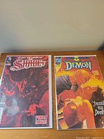 Front view of both bagged and boarded comic books showing cover art and issue information.