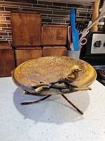 Top view of hammered tin bowl with bird figure