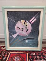 Full view of framed abstract mixed media collage