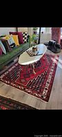 Full view of Persian wool rug under coffee table